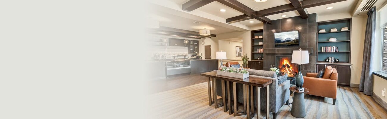 Soft seating and fireplace in the lobby at Cedar River Healthcare Center