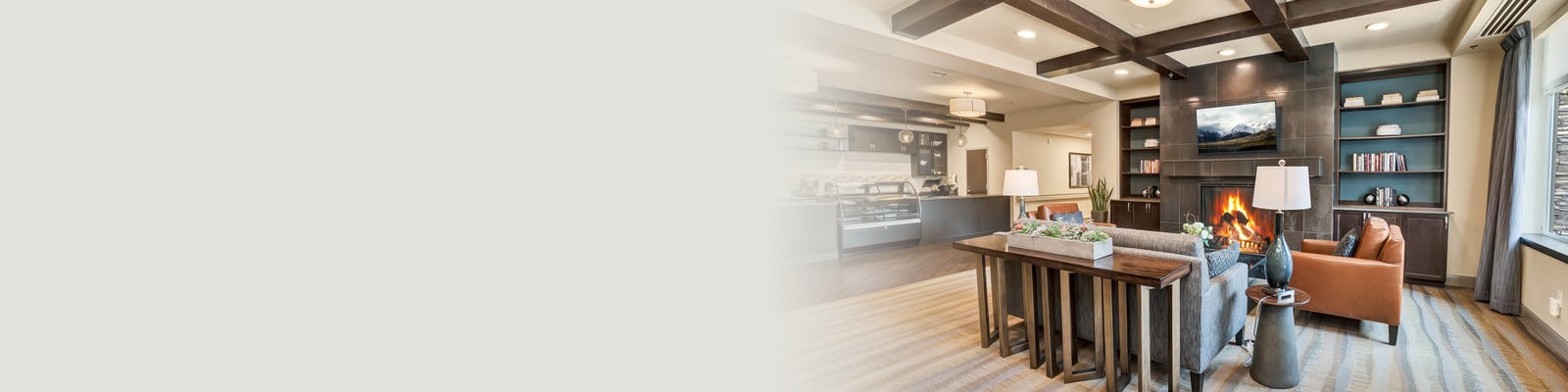 Soft seating and fireplace in the lobby at Cedar River Healthcare Center